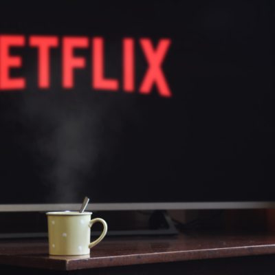 Netflix on TV with coffee
