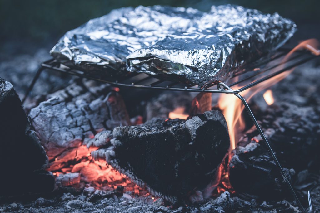 Cooking a meal over the campfire