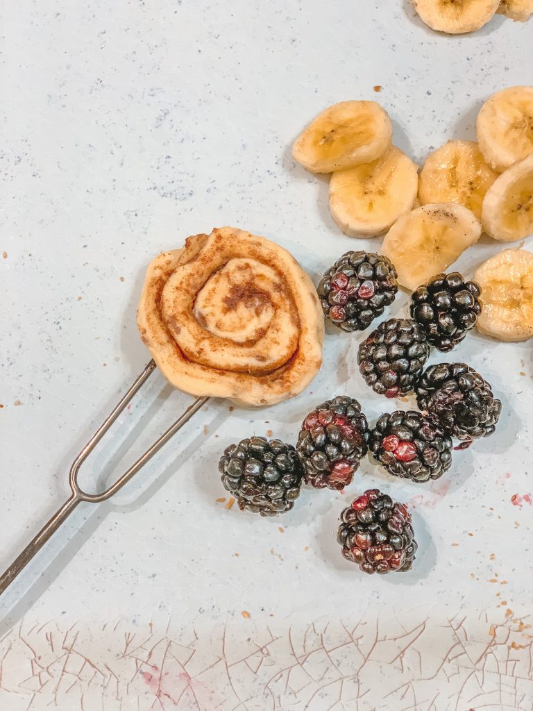 cinnamon roll on a campfire stick