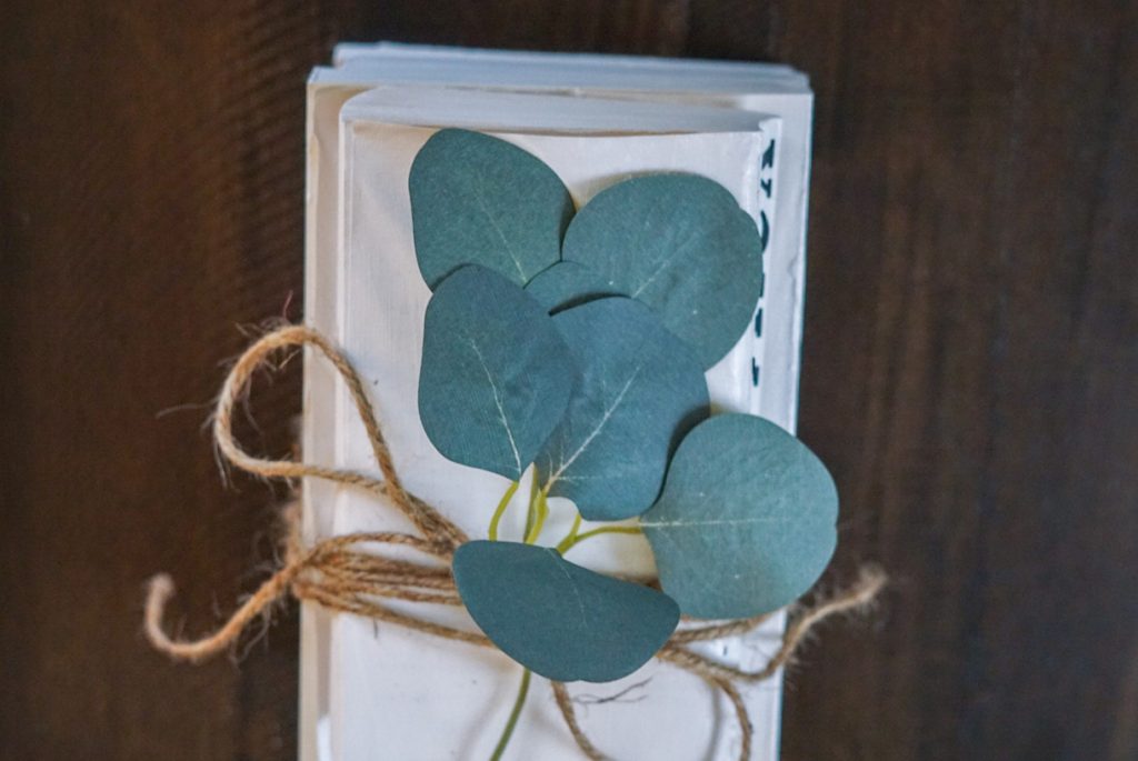 book stack with greenery