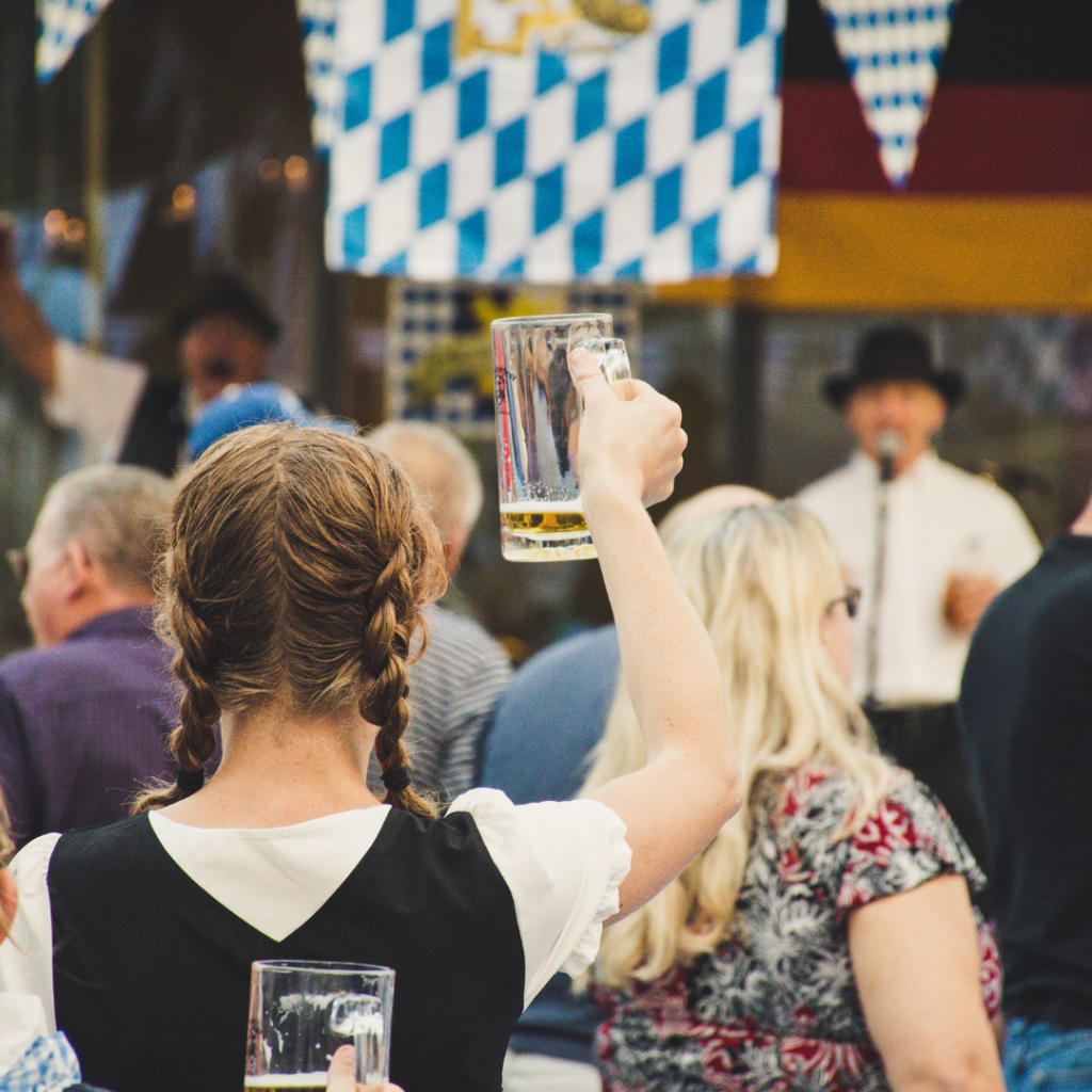 Oktoberfest holding up beer