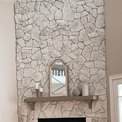 whitewashed stone fireplace